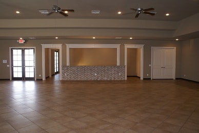 Event hall main room with tile floors and ceiling fans